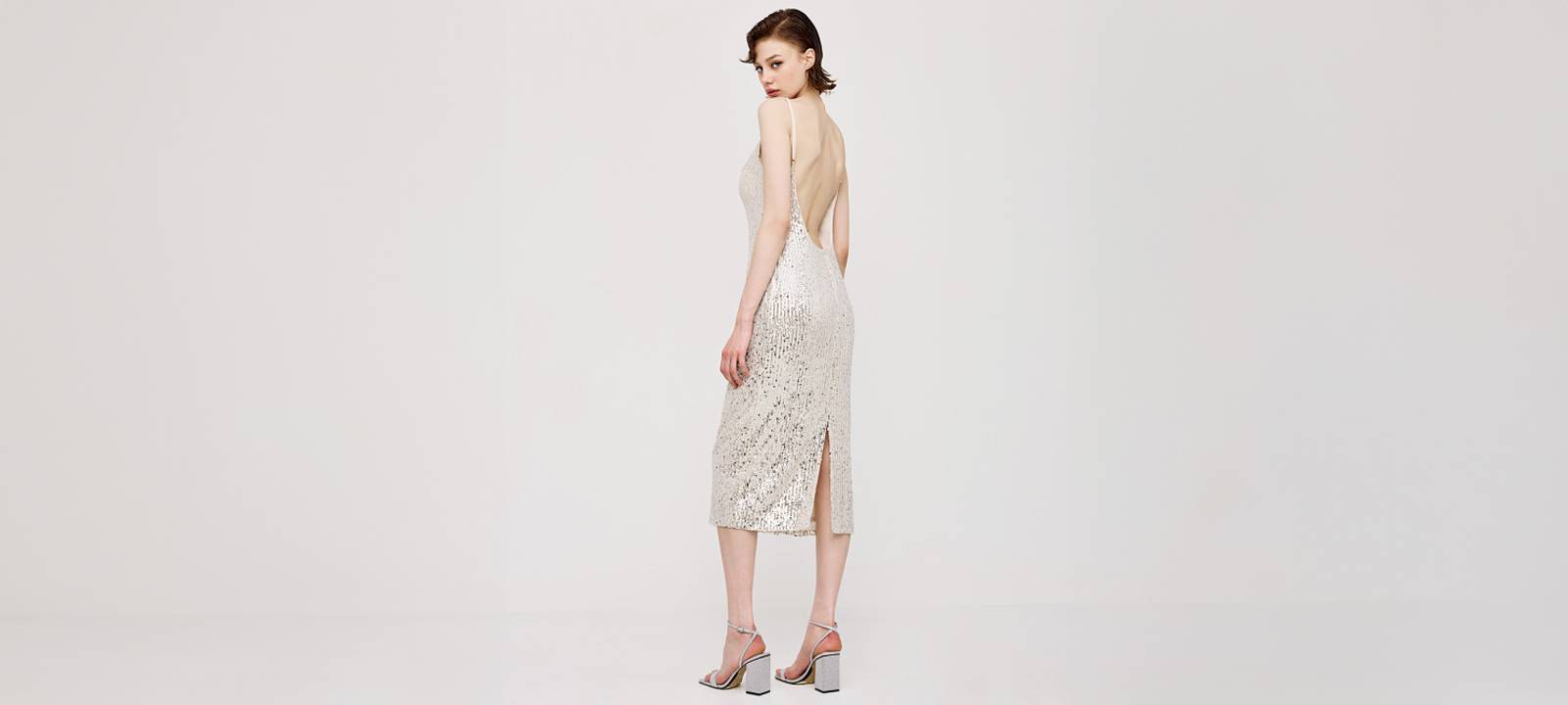 Shop a sequin dress with low back in silver in London, UK