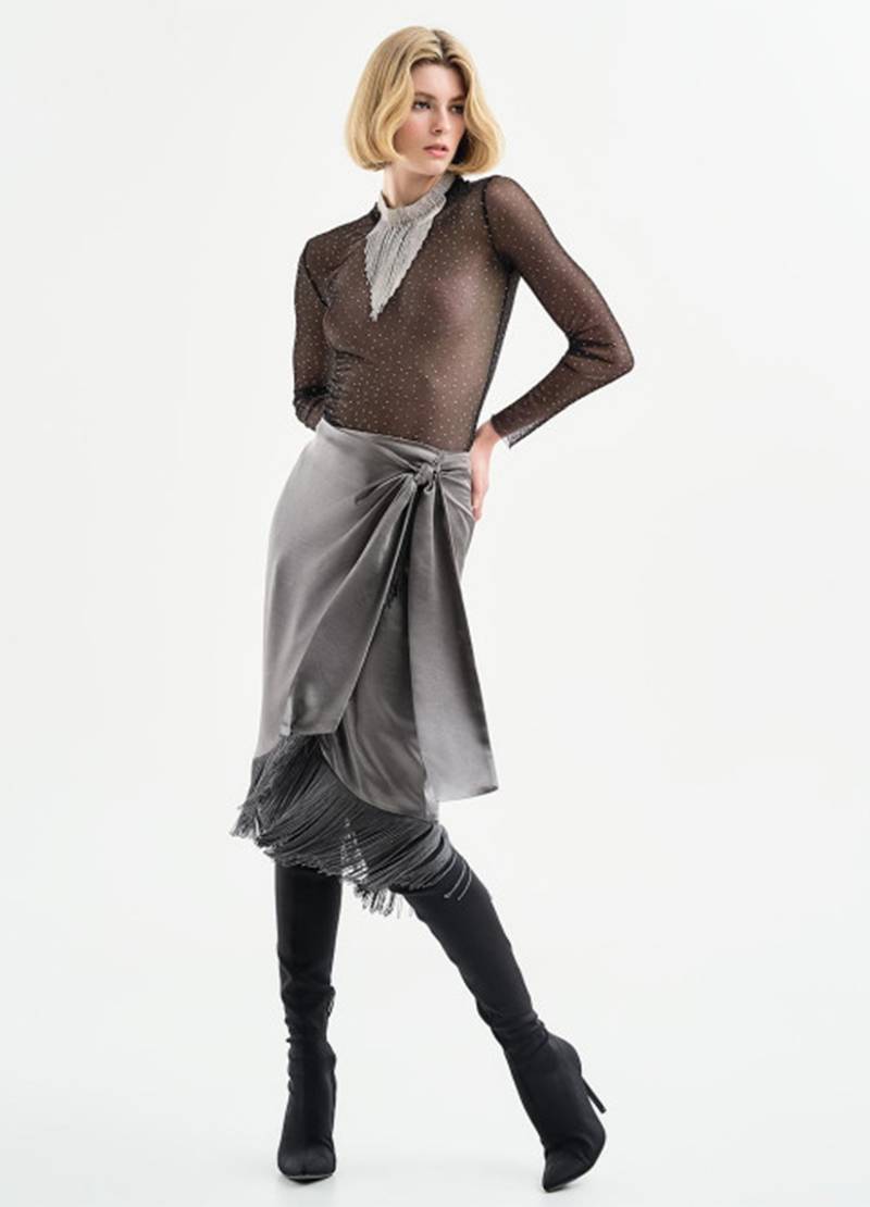 Mesh blouse with long sleeves and details of silver-hued glitter in black in London, UK