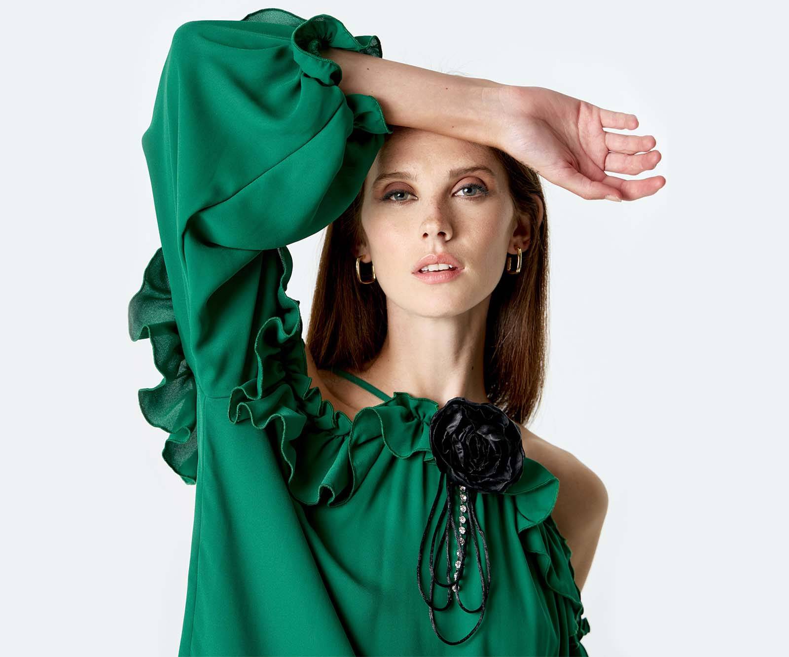 Ruffled long-sleeve blouse with shoulder cut-outs and a flower pin in green in Cork, Ireland