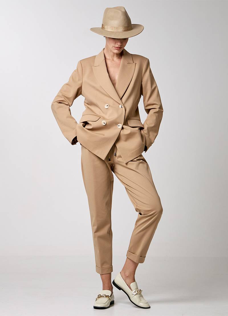 Straight-leg pants with side pockets and turn-up hemlines in camel brown in Copenhagen, Denmark