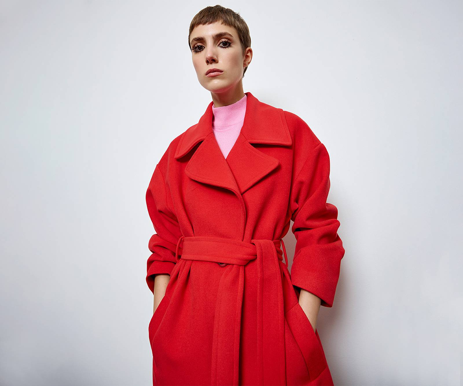 Long coat with a lapel collar with side welt pockets in red in Glasgow near Edinburgh 