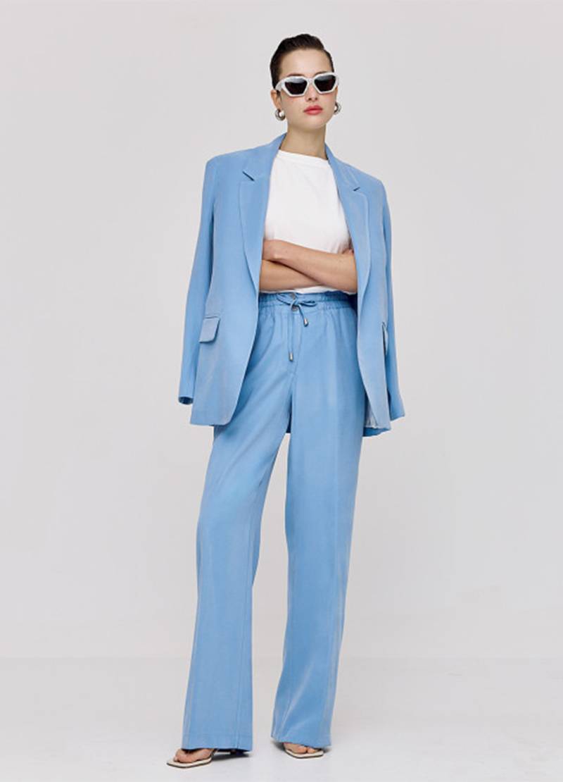 Regular-fitted blazer that features flap pockets in blue in London, UK