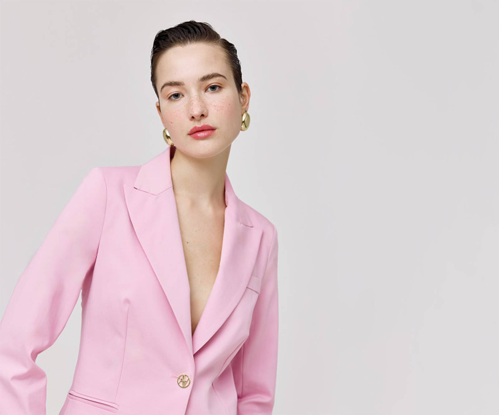 Tailored, single-button blazer with monogram details in pink in London, UK
