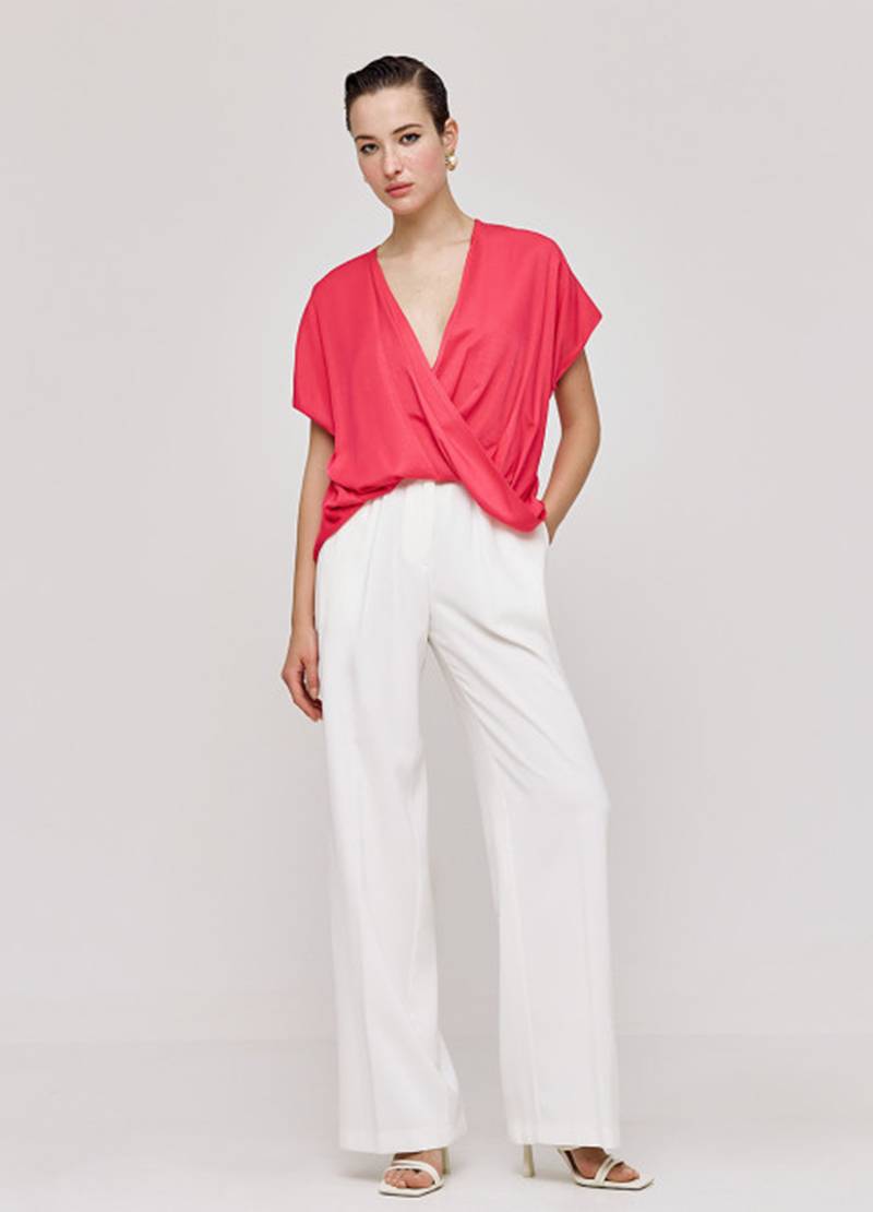 High-waist, wide-leg pants with an elastic waistband in off-white in Brussels, Belgium