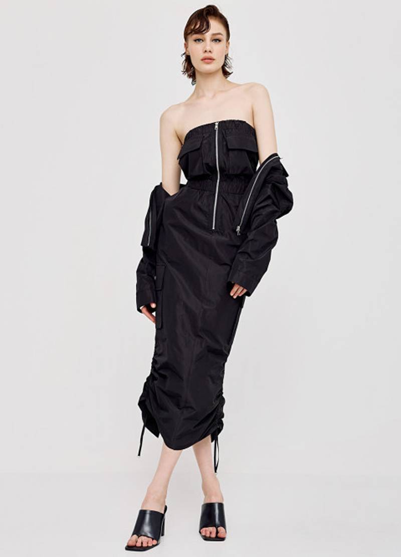 Long, strapless dress with pockets at the front and sides in black in London, UK
