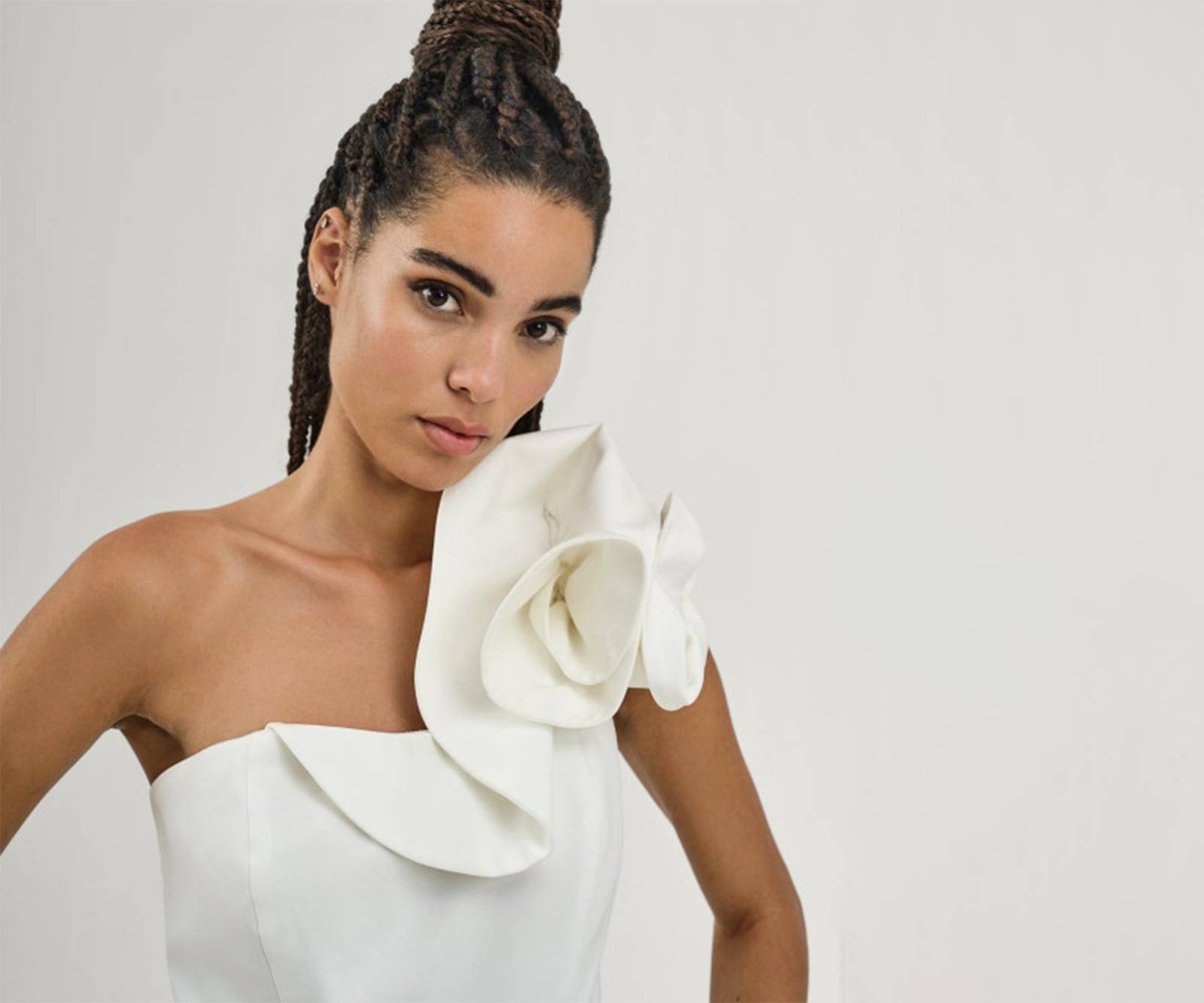 One-shoulder jumpsuit with ruffle details in off white in Copenhagen, Denmark