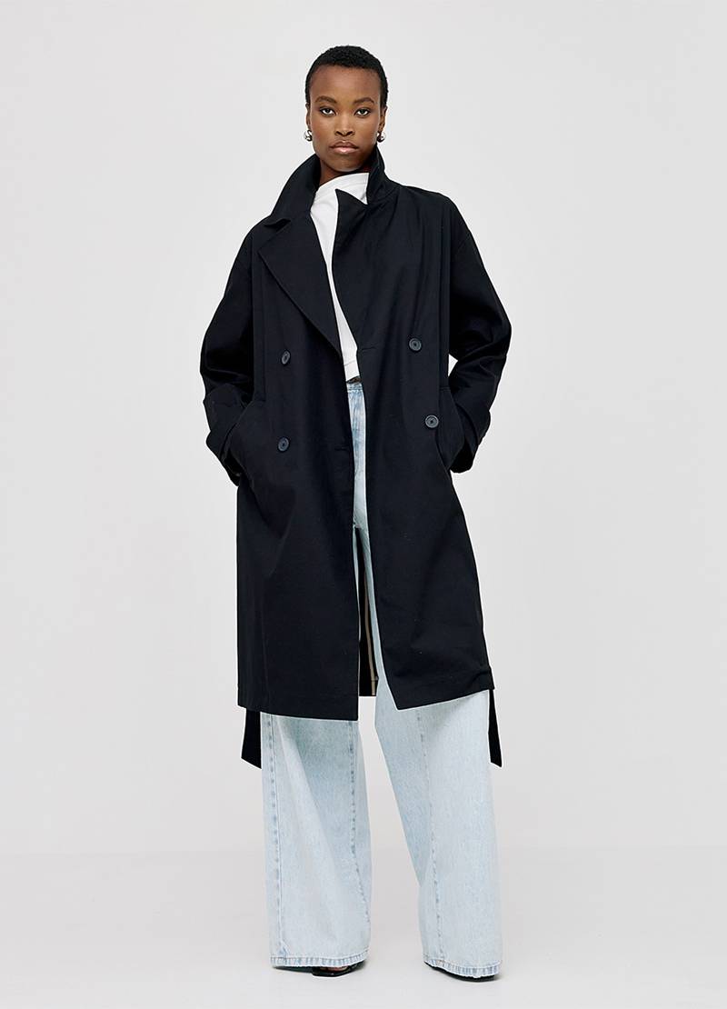 Long, double-breasted trench coat in black in Cardiff, Wales