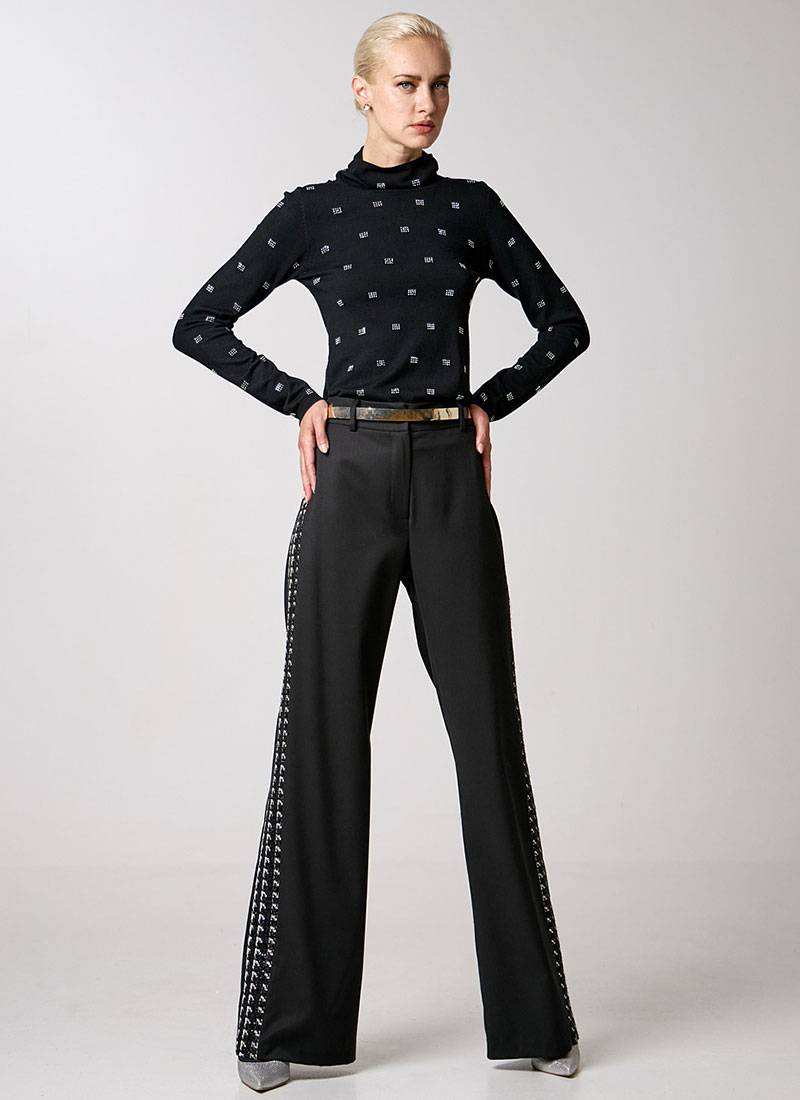 Knitted turtleneck blouse with long sleeves and rhinestone embellishments in black in Copenhagen, Denmark