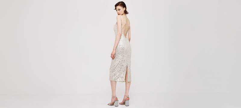 Shop a sequin dress with low back in silver in London, UK
